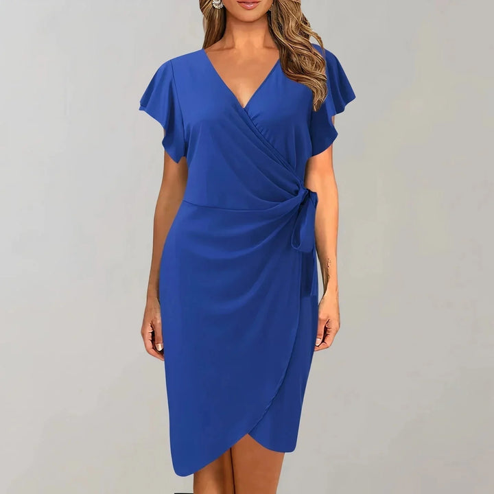 Blue V-neck wrap-style flutter sleeve dress made with soft, flowing fabric. Timeless and elegant design perfect for any…