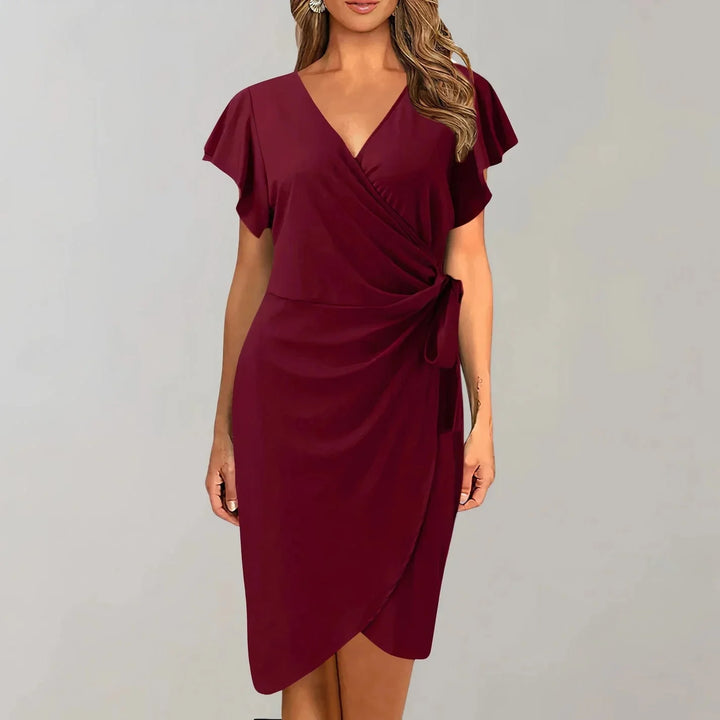 Wine red V-neck wrap-style dress with flutter sleeves in a lightweight flowy fabric perfect for summertime elegance.