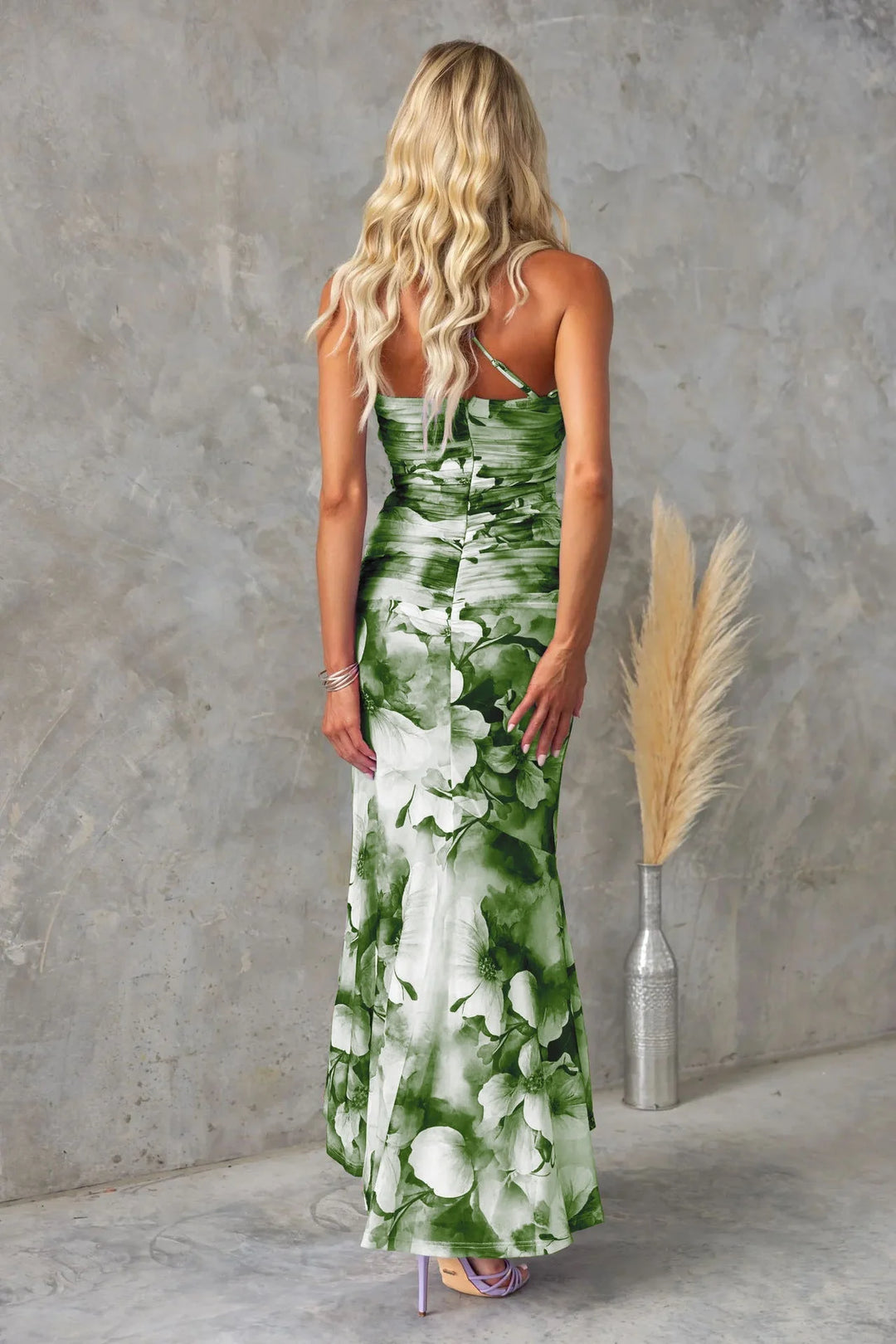 Blue floral midi dress with a strapless design, perfect for summer events. Made of lightweight and breathable fabric for…
