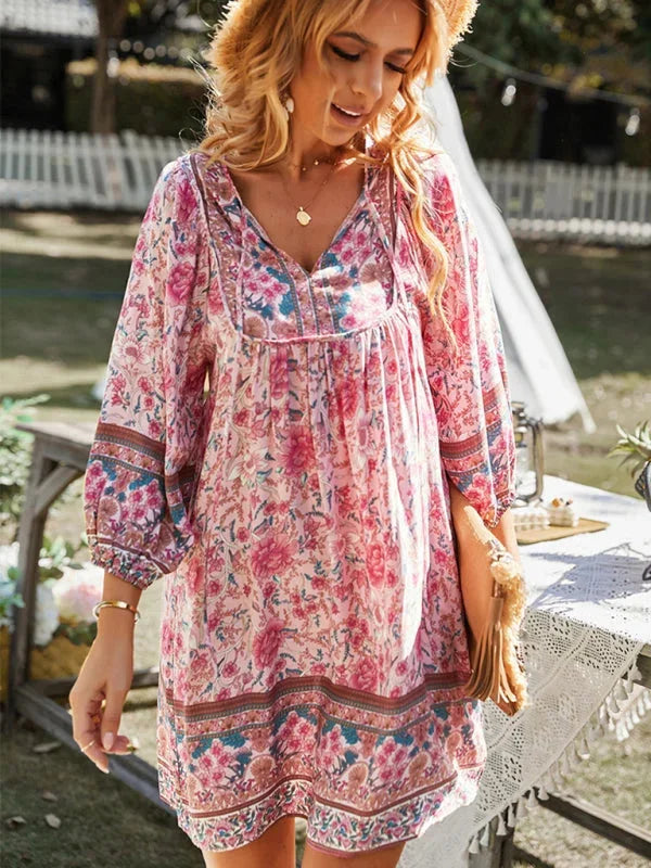 Boho-inspired mini dress in delicate prints, perfect for a breezy summer day, featuring soft and flowy fabric.