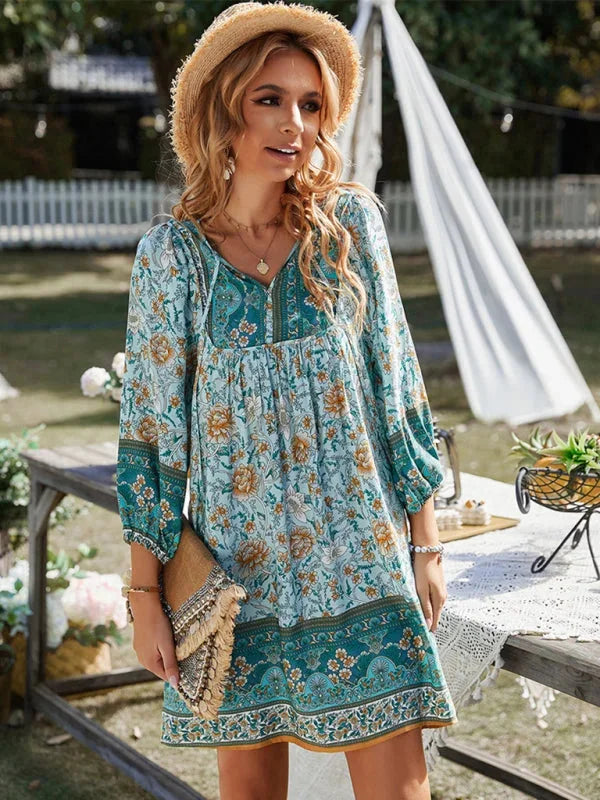 Blue boho-inspired mini dress with delicate prints, featuring a flowy silhouette and breathable fabric perfect for a casual…