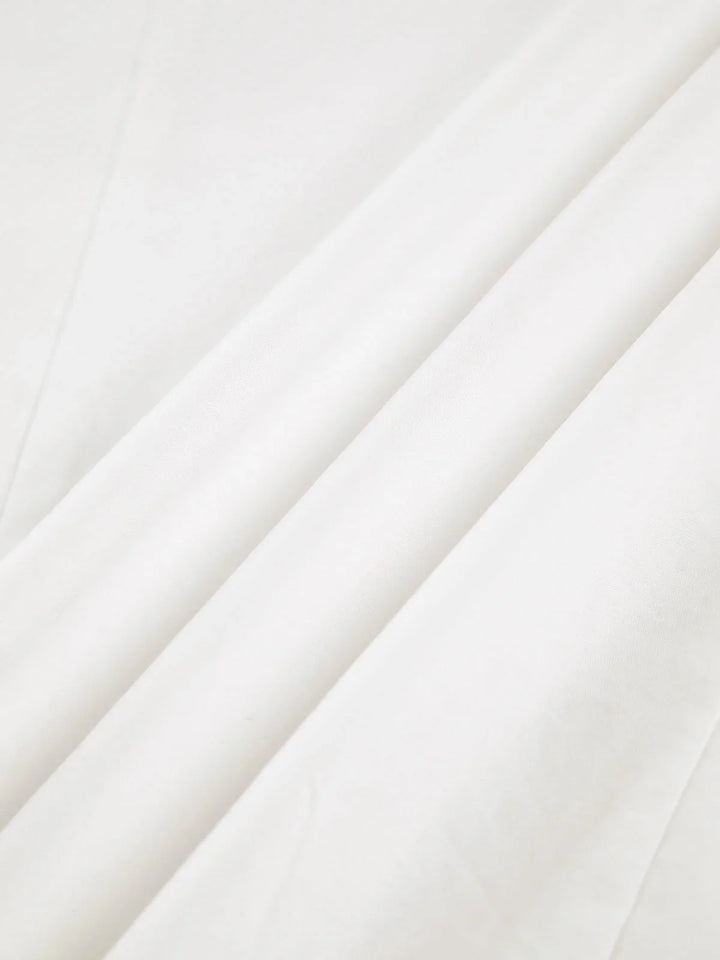 Oversized button-detail shirt by Mavis in a chic, relaxed fit design.