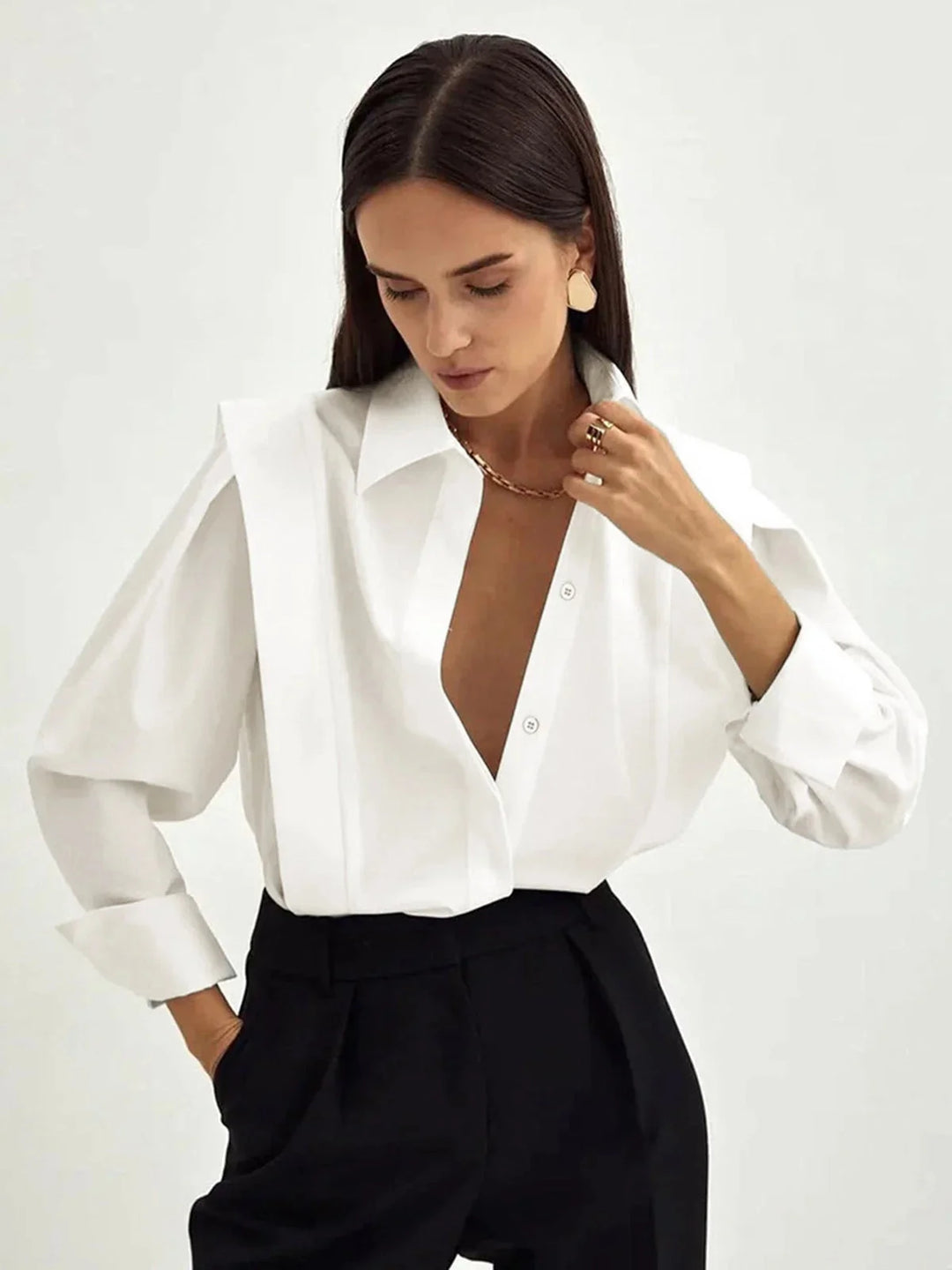 Oversized button-up shirt in chic style, featuring intricate button details, made from high-quality breathable fabric.