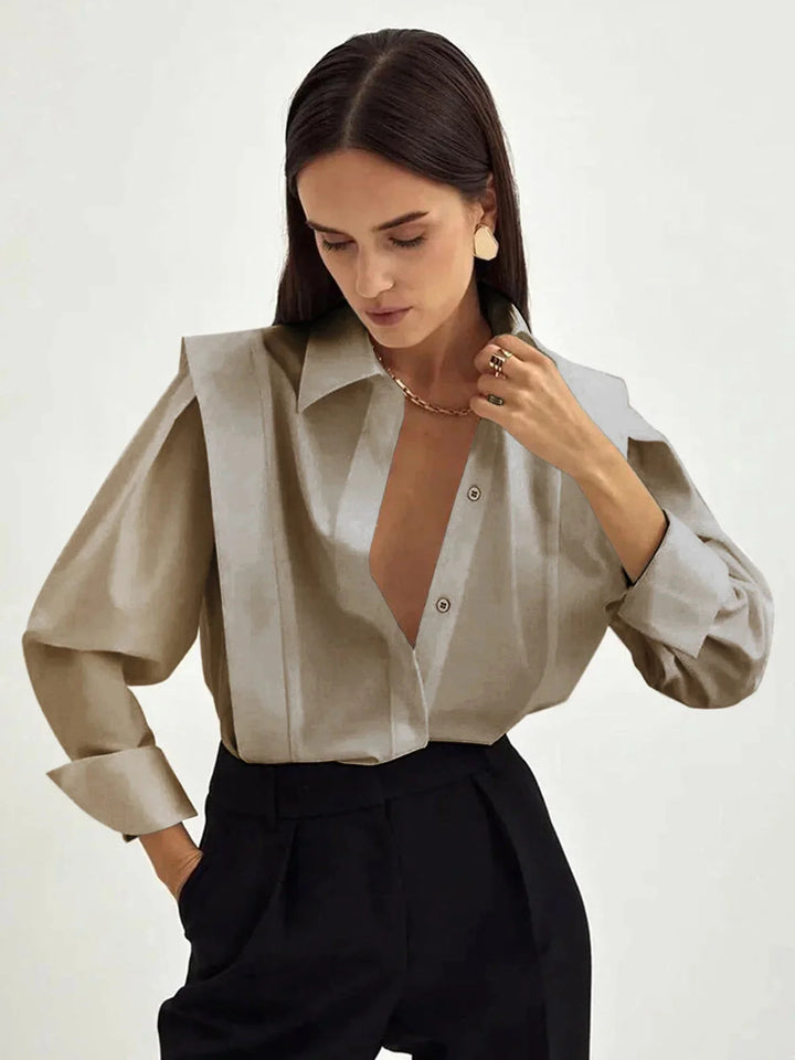 Khaki oversized shirt with button details, a chic and versatile wardrobe staple made from high-quality comfortable fabric.