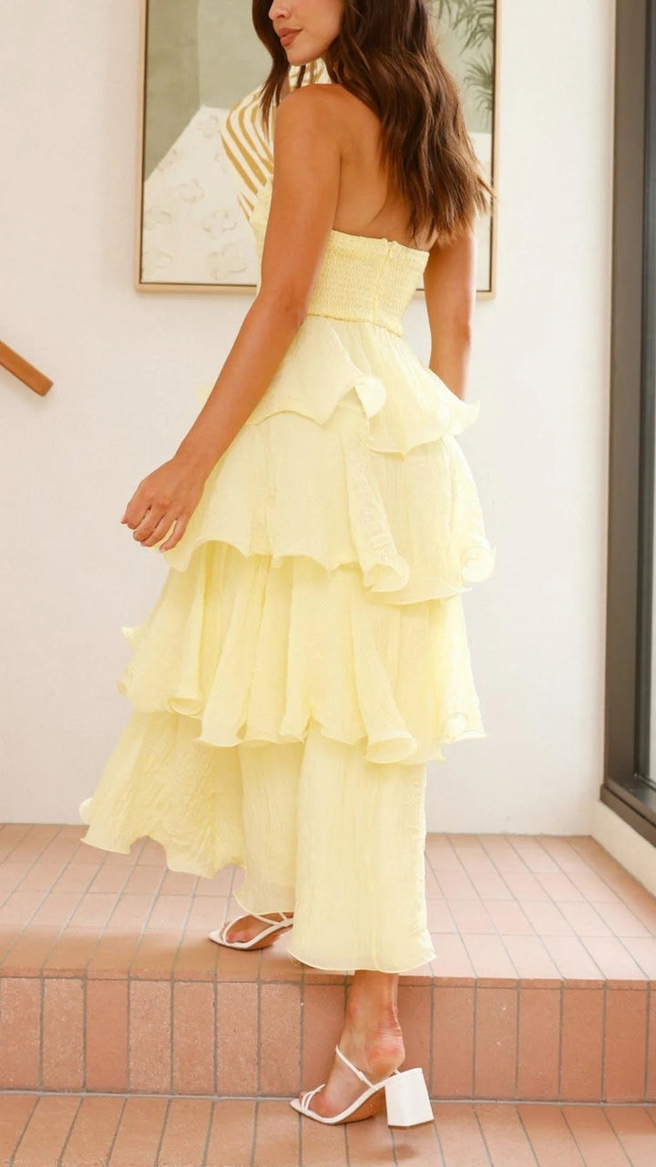 Strapless tiered dress in soft chiffon with elegant layers and a sweet neckline, available in multiple colors.