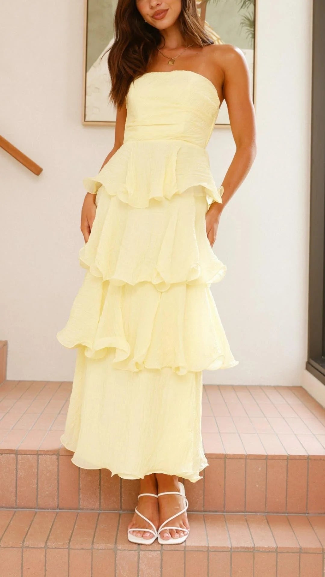 Yellow strapless tiered dress featuring elegant layers, perfect for a chic and stylish look. Made from high-quality…