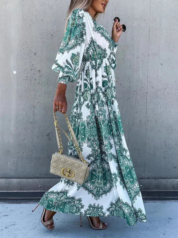 "Meena maxi dress in paisley pattern with high slit, made from flowing fabric for a chic and elegant look"