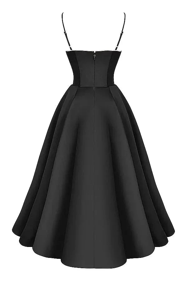 "Black satin dress with cream tulle overlay, perfect for elegant occasions."