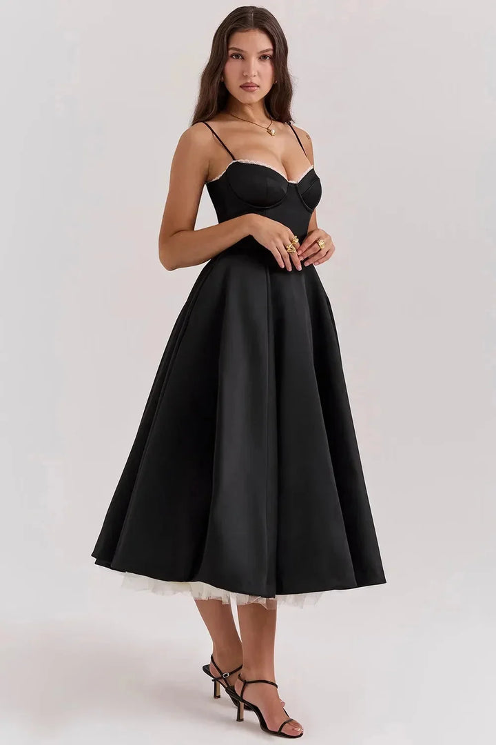 Satin black dress with soft cream tulle, perfect for a chic & elegant look at special occasions.