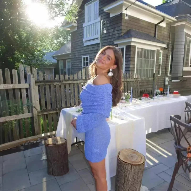 Off-shoulder mini dress in shimmer fabric, perfect for sunny events.