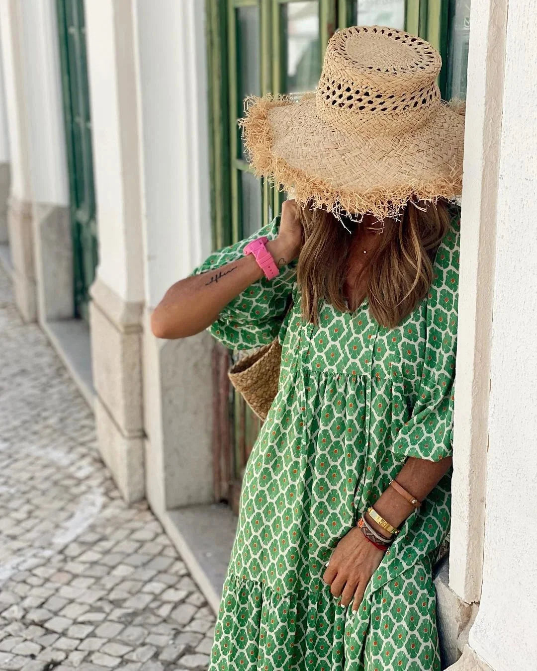"Maxi dress featuring colorful playful print, ideal for sunny days. Made from soft, breathable fabric."