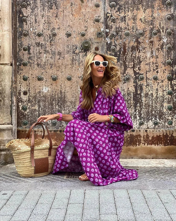 "Maxi dress in vibrant print design, ideal for warm weather. Features soft, flowy fabric for comfortable wear."