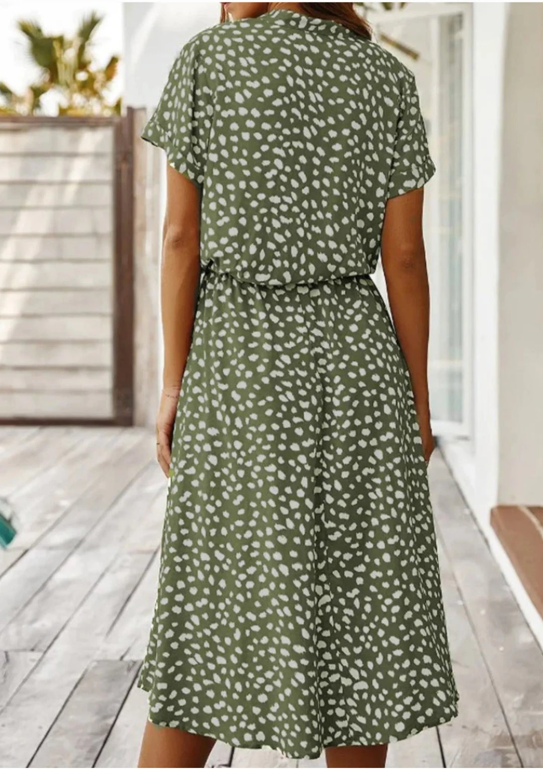 Polka dot midi dress with waist tie, featuring a lightweight fabric and playful print perfect for everyday wear.