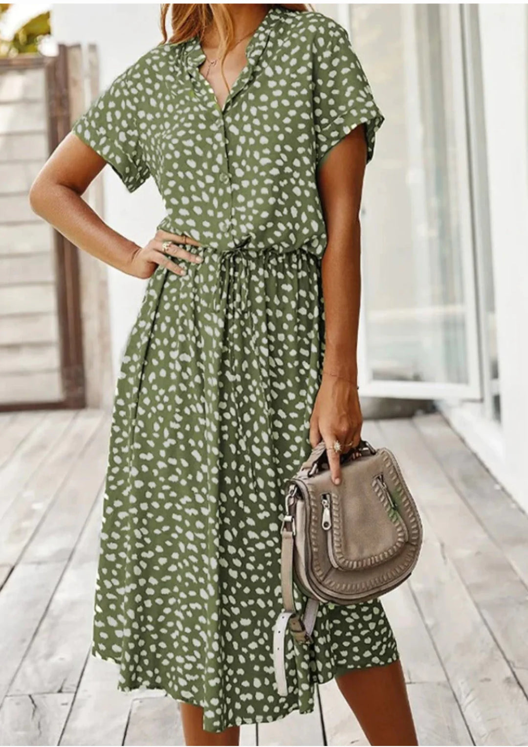 Green polka dot midi dress with waist tie from Miani. Made of lightweight, flowy fabric perfect for everyday wear or special…