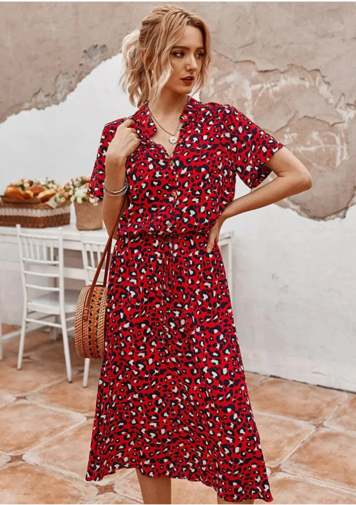 Red midi dress with white polka dots and a waist tie. Made from soft and comfortable fabric. Classic and stylish design for…