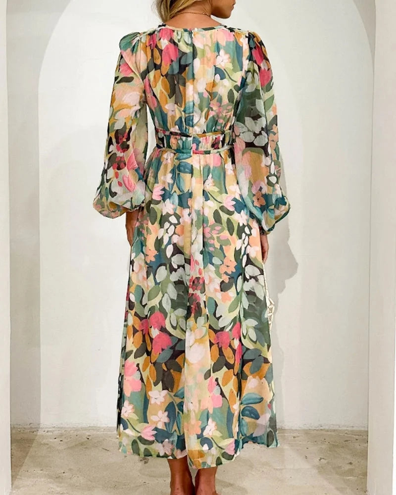 "Pastel-toned floral print maxi dress with long sleeves, perfect for a feminine and elegant look."