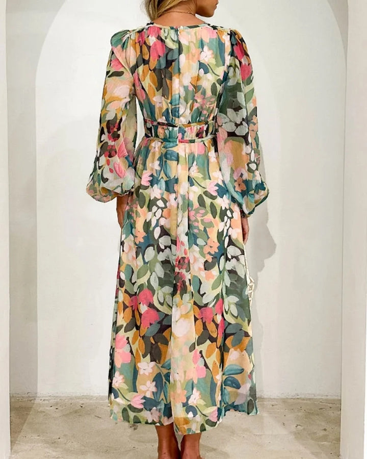 "Pastel-toned floral print maxi dress with long sleeves, perfect for a feminine and elegant look."