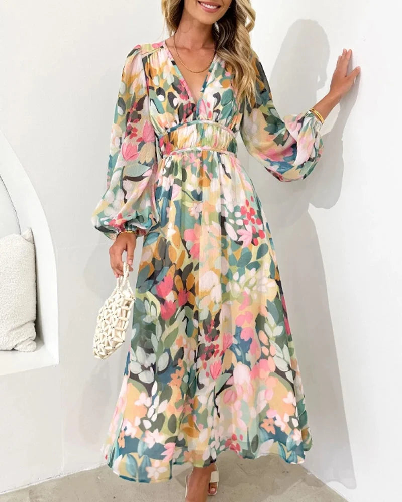 "Mikaela long sleeve floral maxi dress in pastel tones, featuring a flowing silhouette with intricate floral patterns in…
