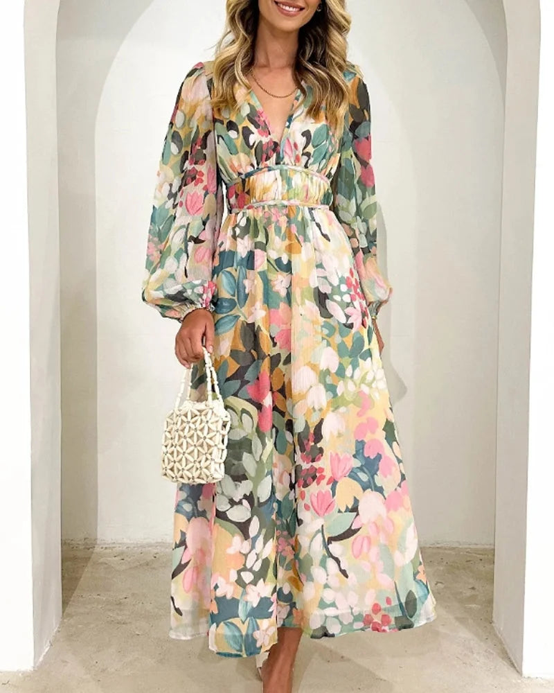 "Pastel-toned floral maxi dress with long sleeves, perfect for a chic and feminine look."