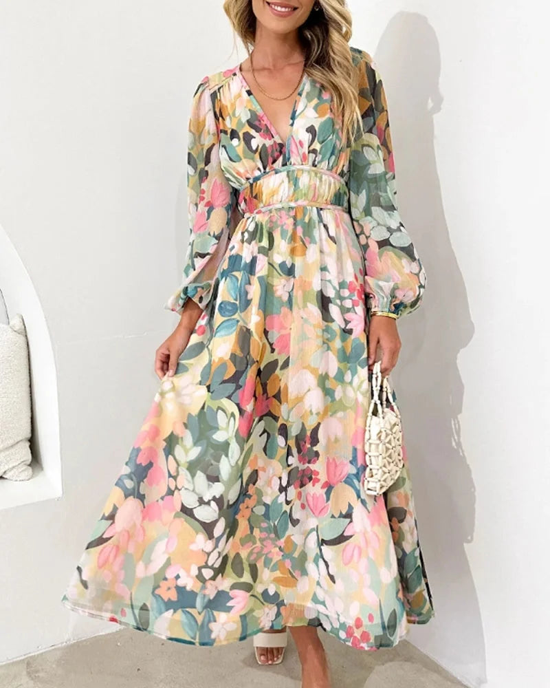 Long sleeve floral maxi dress in pastel green tones, flowy fabric with dainty flower print, perfect for a casual yet elegant…