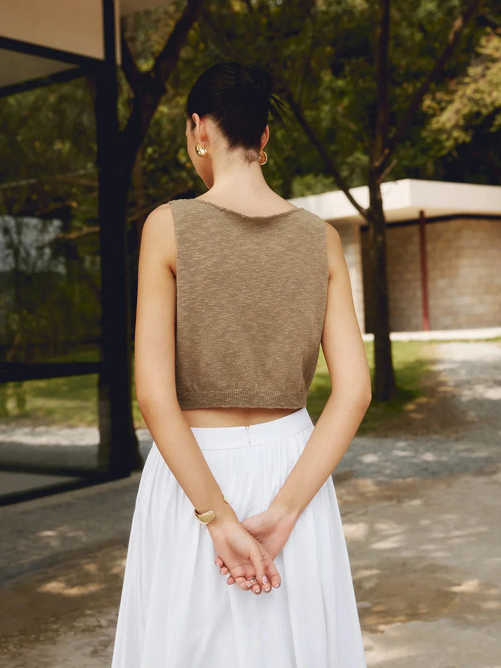 Sleeveless crop top with textured pattern, ideal for casual and formal looks. Made from soft and breathable fabric for…