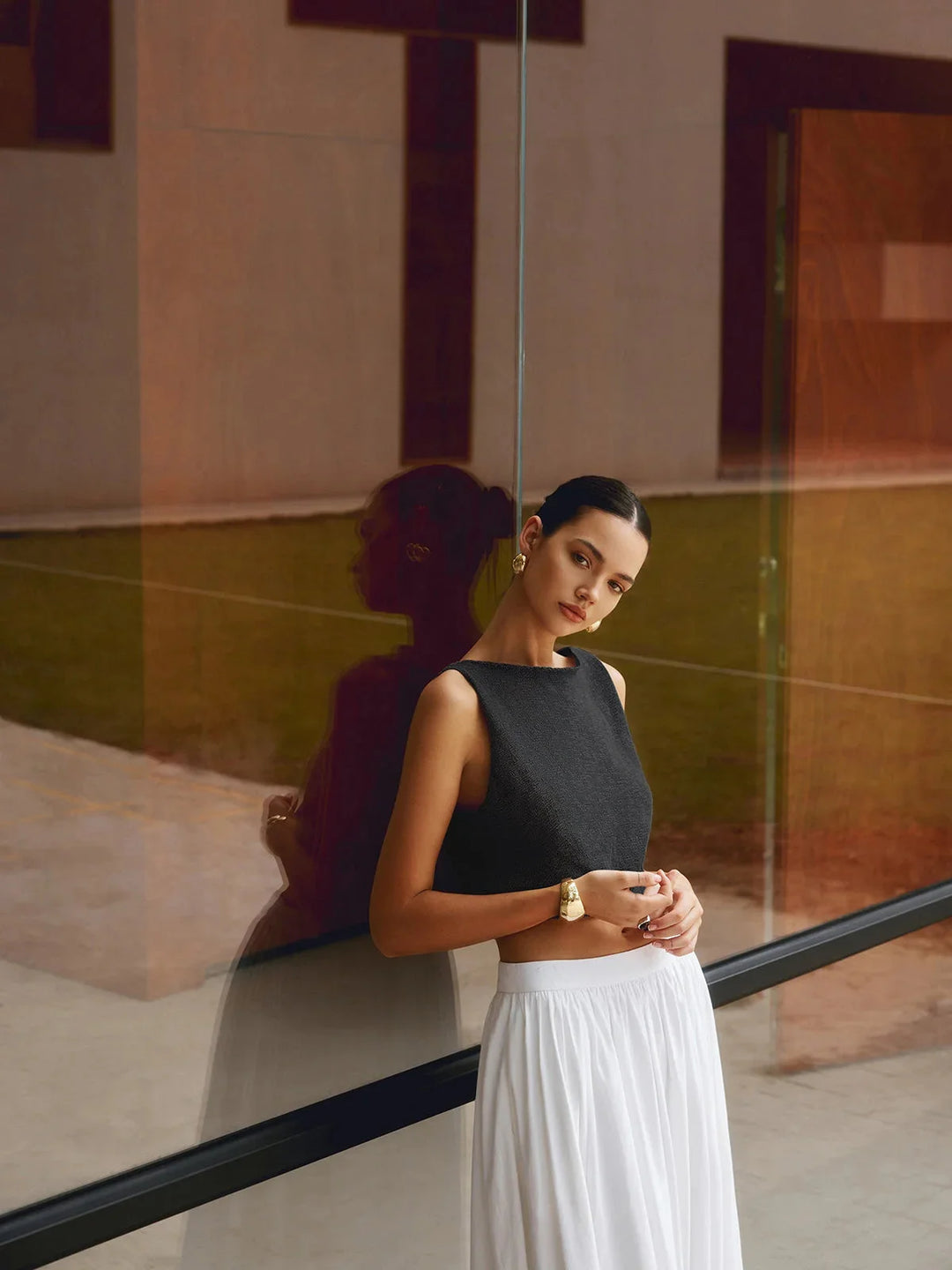 White textured sleeveless crop top with ribbed design and high neckline by Mikah - perfect for summer outfits.