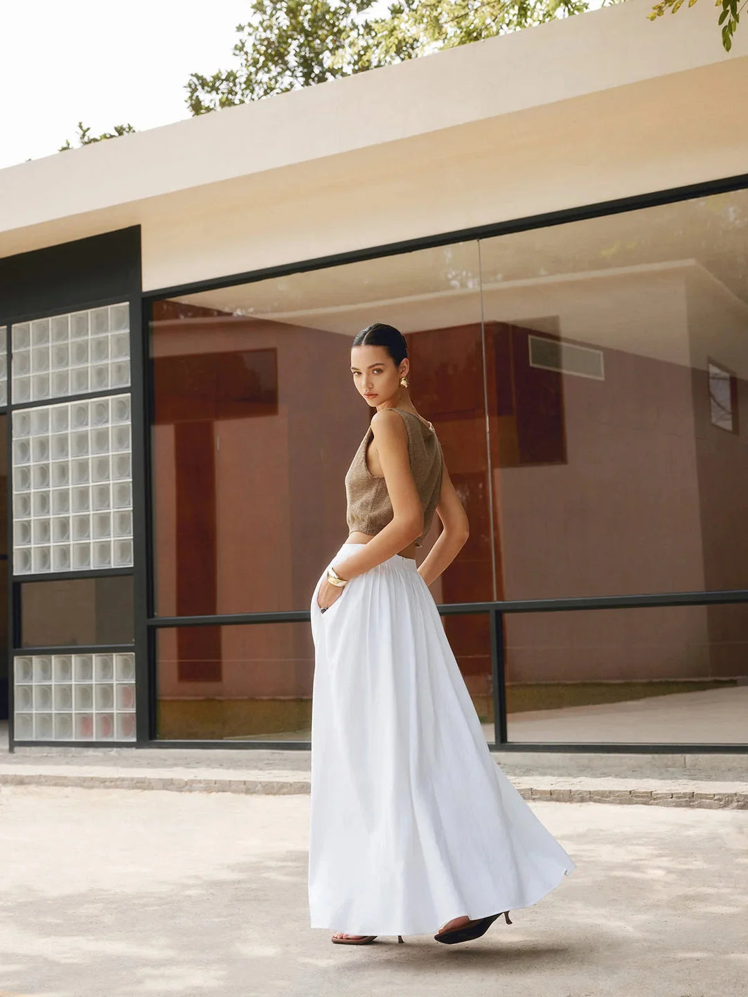 Sleeveless crop top with textured detailing, perfect for summer.