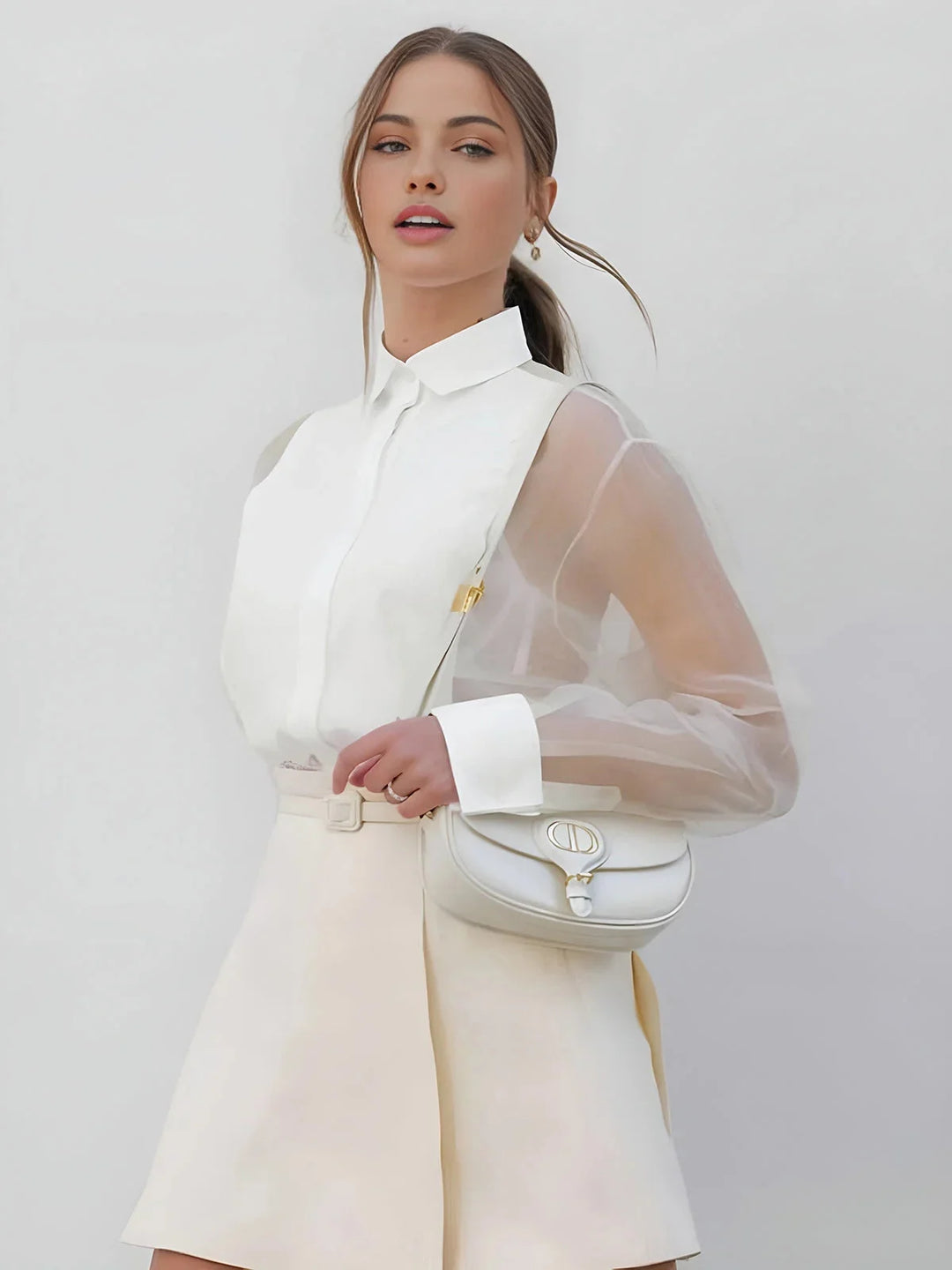 White collared dress with sheer sleeves, timeless and elegant design.