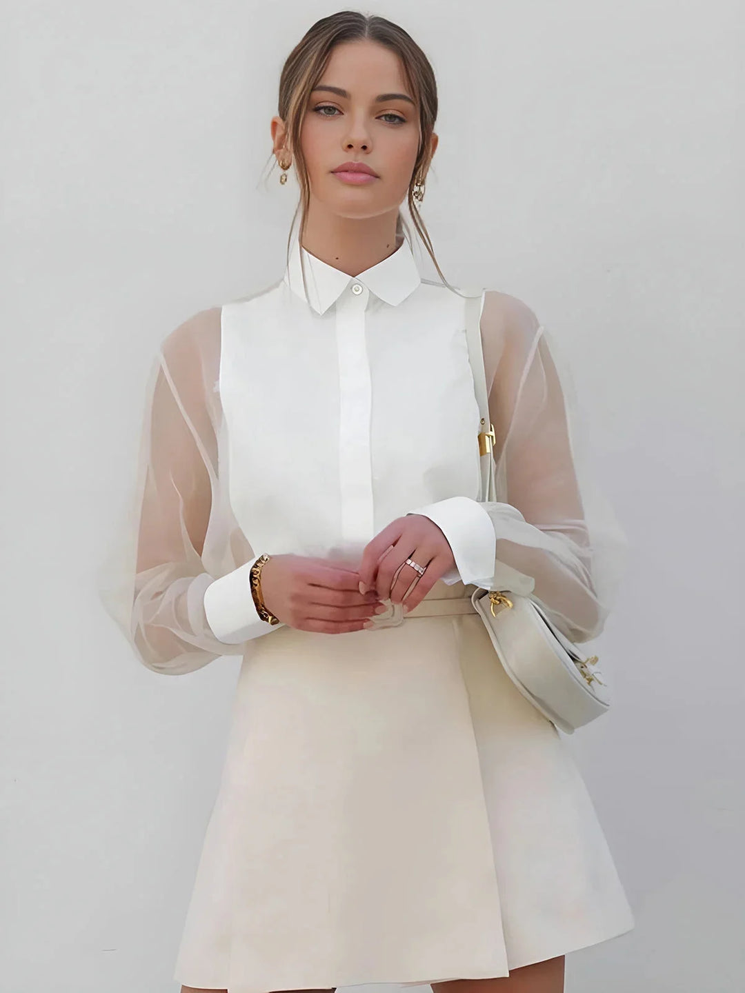 White collared dress with sheer sleeves, trendy and chic design perfect for any occasion.