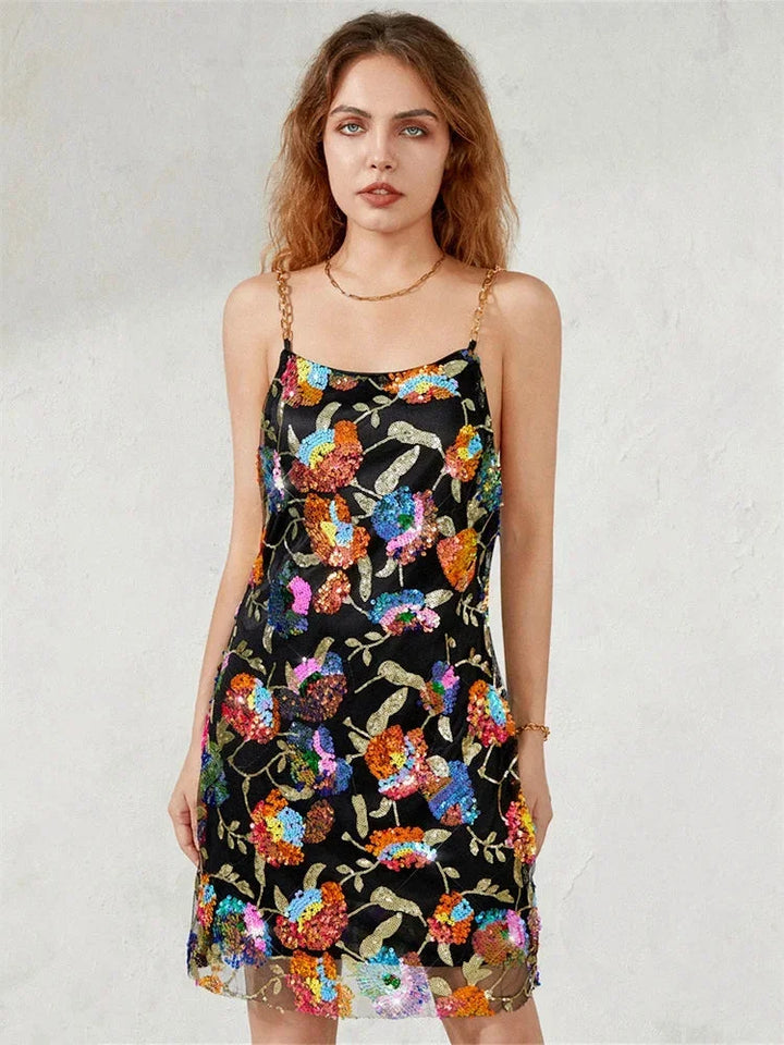"Colorful abstract print mini dress featuring a sleek silhouette, perfect for daytime outings."