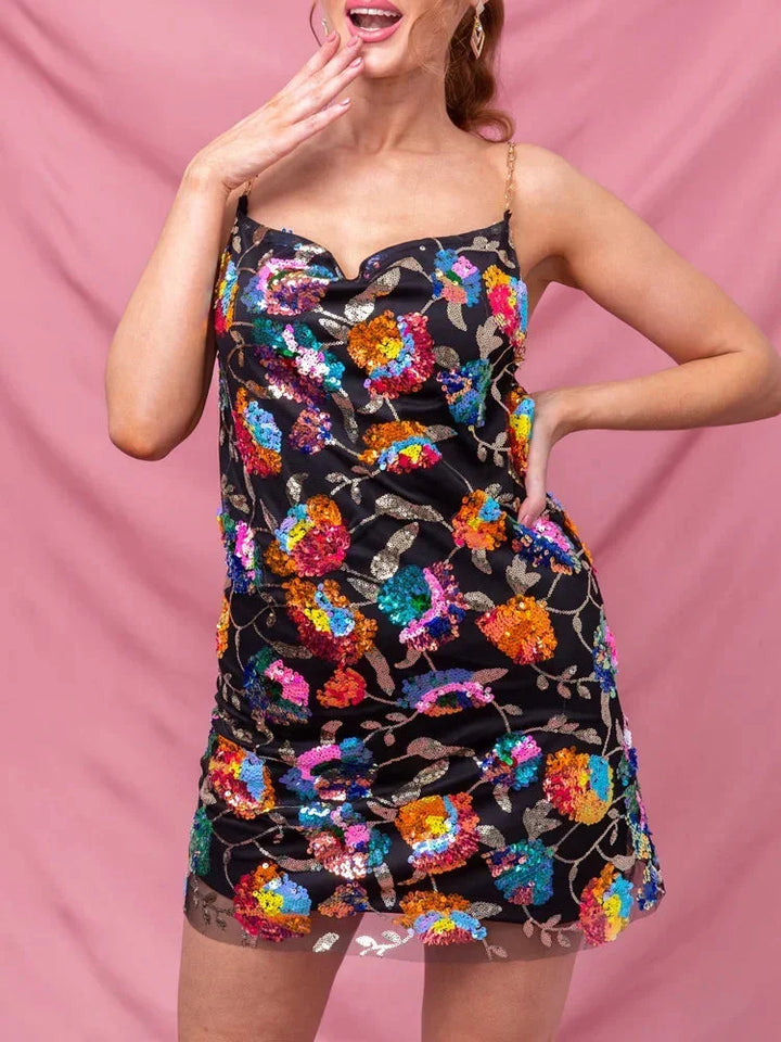 Black mini dress with a vibrant print in soft fabric. Features a sleek design, perfect for a bold yet sophisticated style…