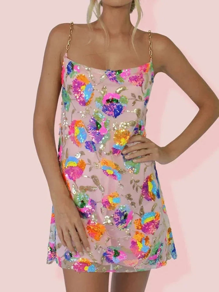 Pink mini dress with vibrant print by Mirella. Features a sleek design and soft, comfortable material perfect for a casual…