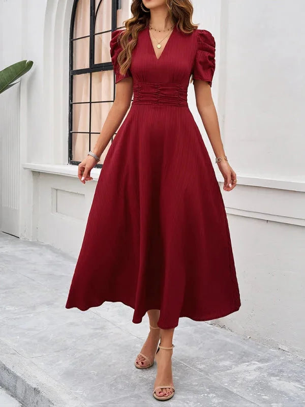 Red puff sleeve V-neck midi dress with flowy silhouette. Made of lightweight fabric. Perfect for casual gatherings or nights…