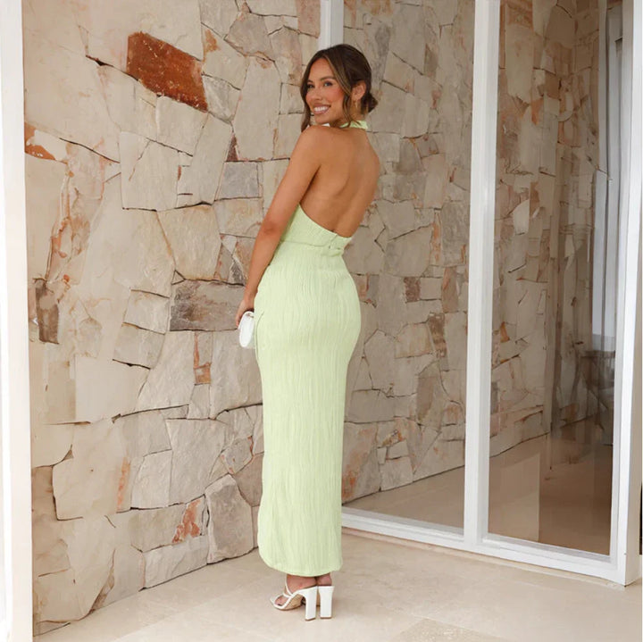 "Lime halter midi dress featuring pleated details, perfect for a summer day out. Made from lightweight and breezy fabric."
