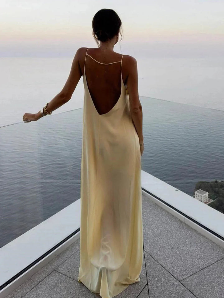 Naisha Women's backless maxi dress featuring sleek straps, made from soft and breathable fabric in a cool and elegant design.