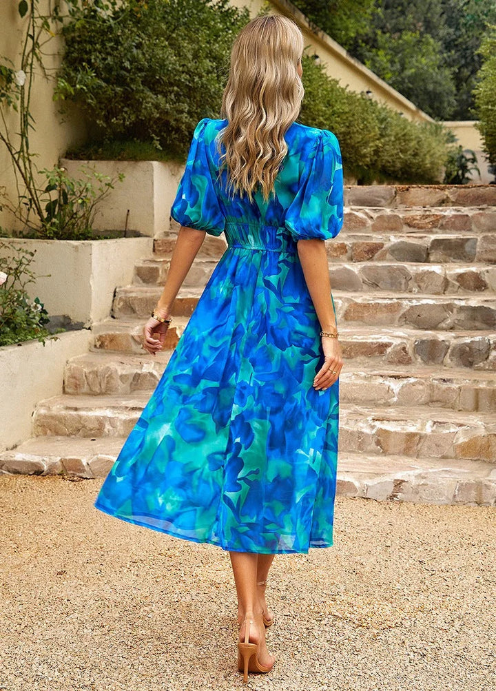 "Nala - Floral midi dress with elastic waist, featuring a soft and breathable material in a charming floral design."