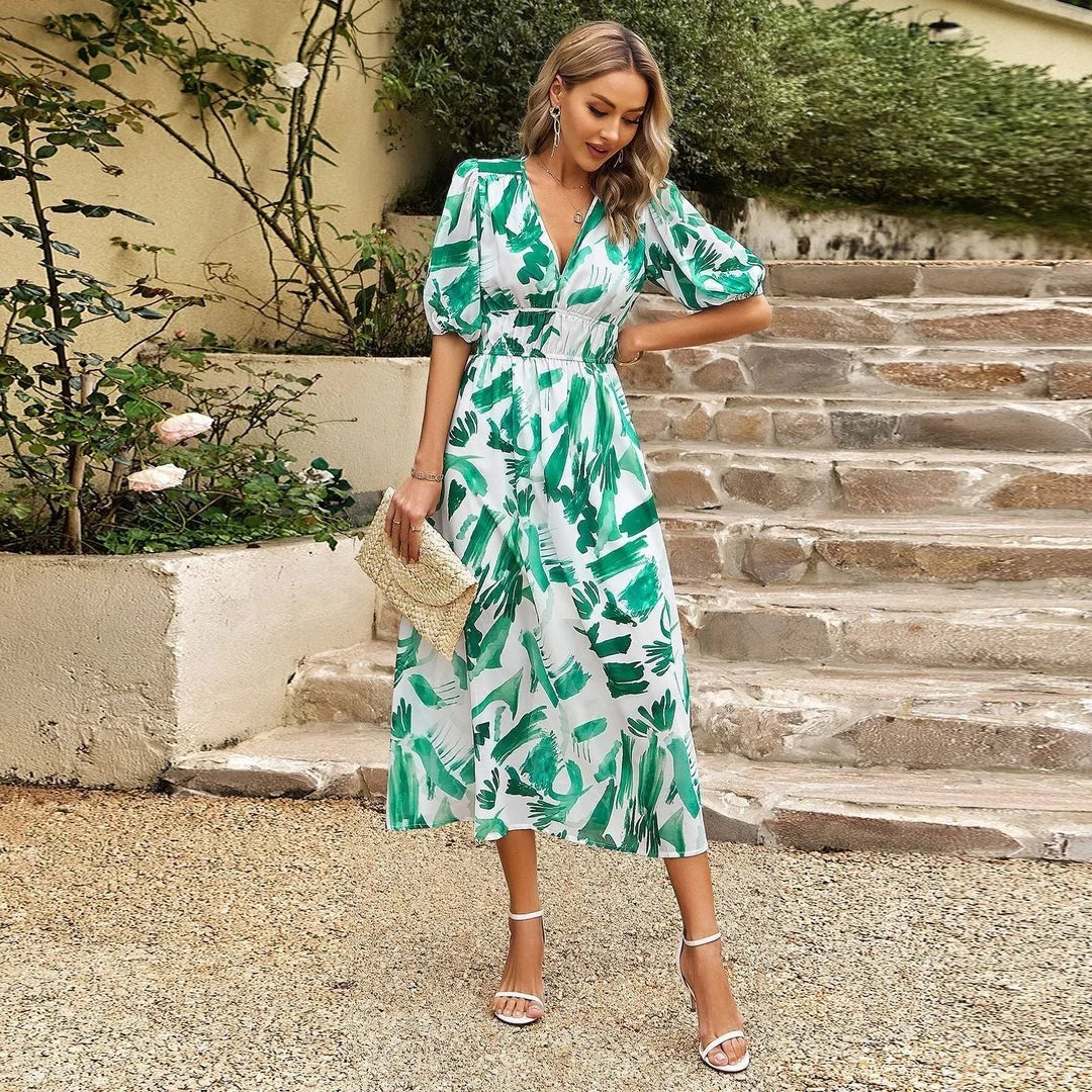 Green floral midi dress with elastic waist made from lightweight and breathable fabric. Perfect for a casual day out or…