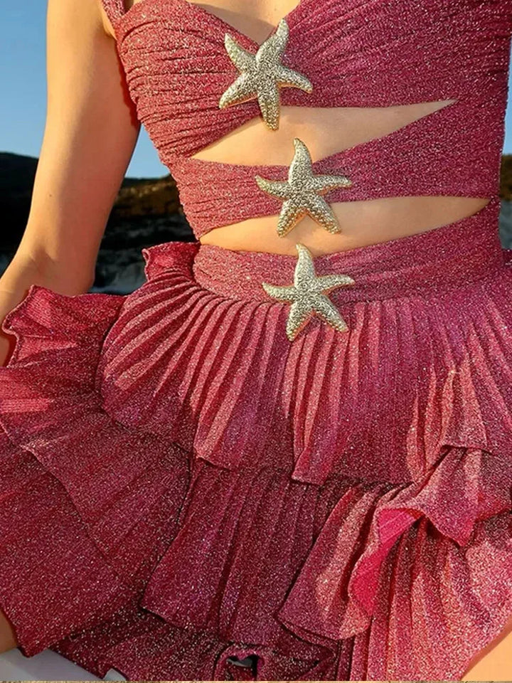 Pink shimmering ruffle dress with star details, a charming choice for any occasion. Medium-weight fabric with a playful yet…
