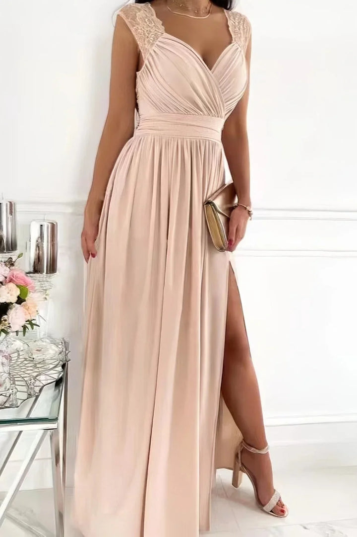 Beige lace maxi dress with a side slit, sleeveless design. Feminine and elegant look for any occasion.
