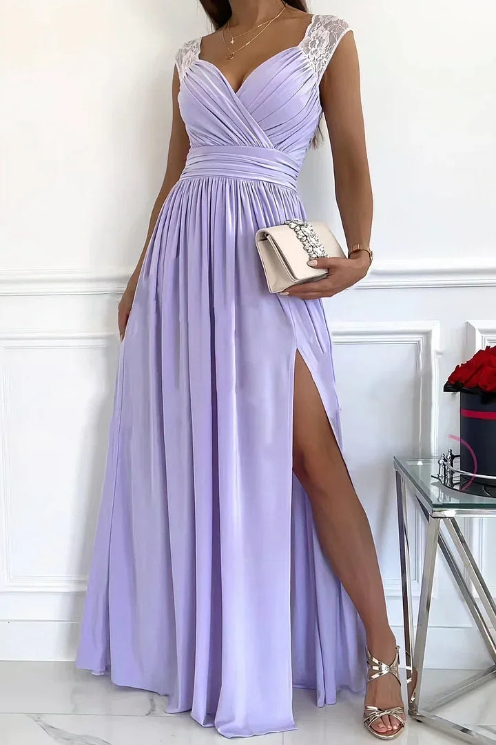 Purple lace maxi dress with slit. Sleeveless design. Perfect for elegant occasions.
