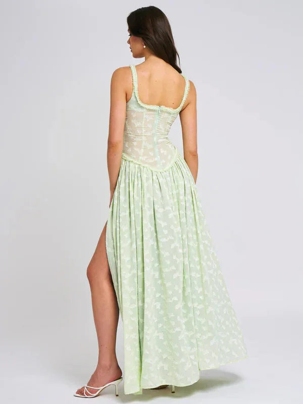 "Natalya maxi dress in green with floral print and side slit, perfect for a chic and breezy summer look."