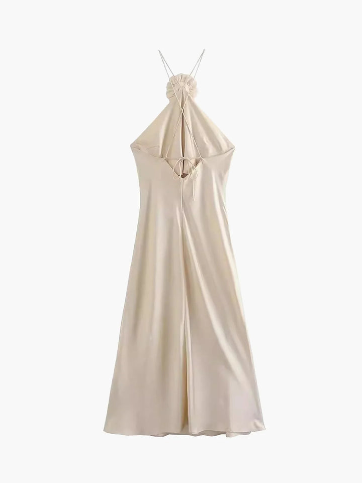 Black satin halter dress with rose decorations on the neckline and a sleek silhouette, perfect for a classy evening outing.