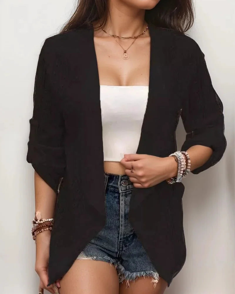 Oversized black blazer with a relaxed fit, perfect for casual wear. Features a versatile design suitable for various…