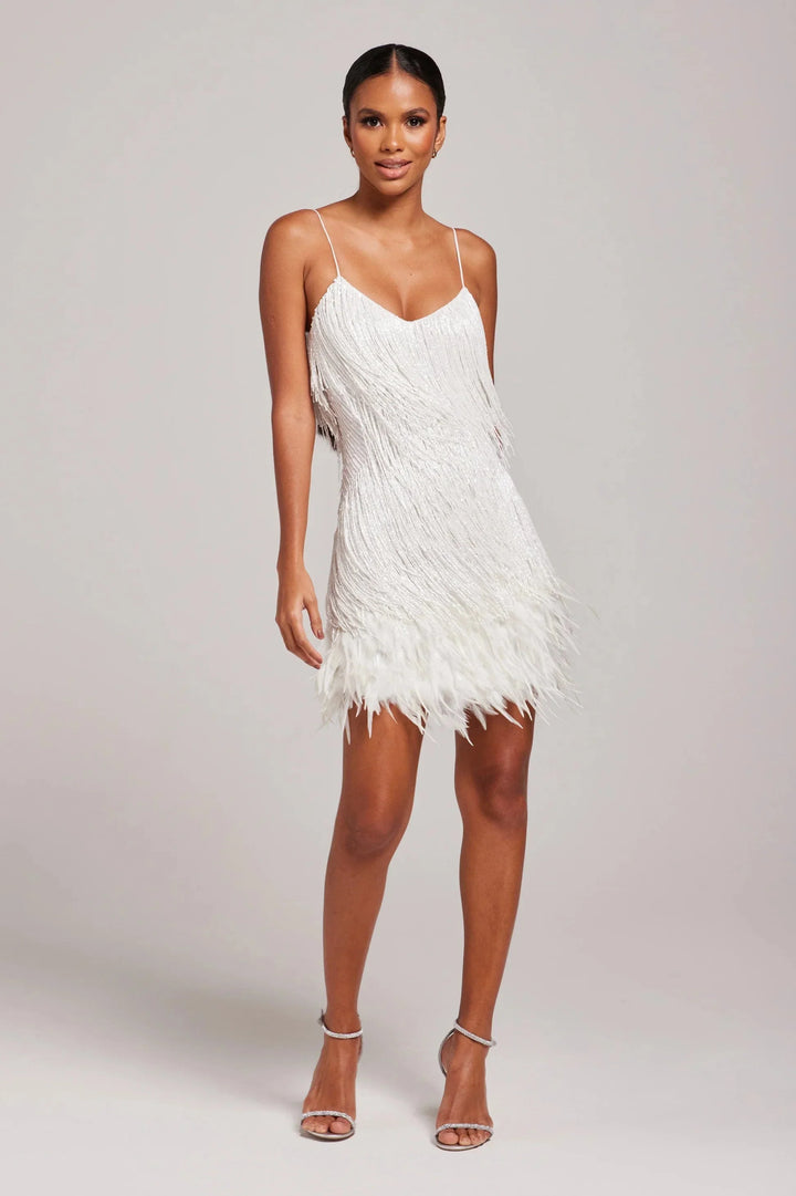 Black feathered mini dress with adjustable straps by Nazaret. Flattering design perfect for a night out or special occasion.