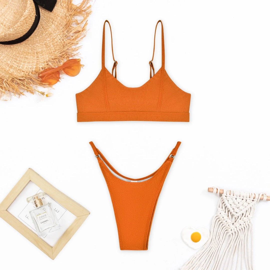 Orange push-up bikini with sleek design for a flawless fit, made with high-quality material for optimal comfort and style.
