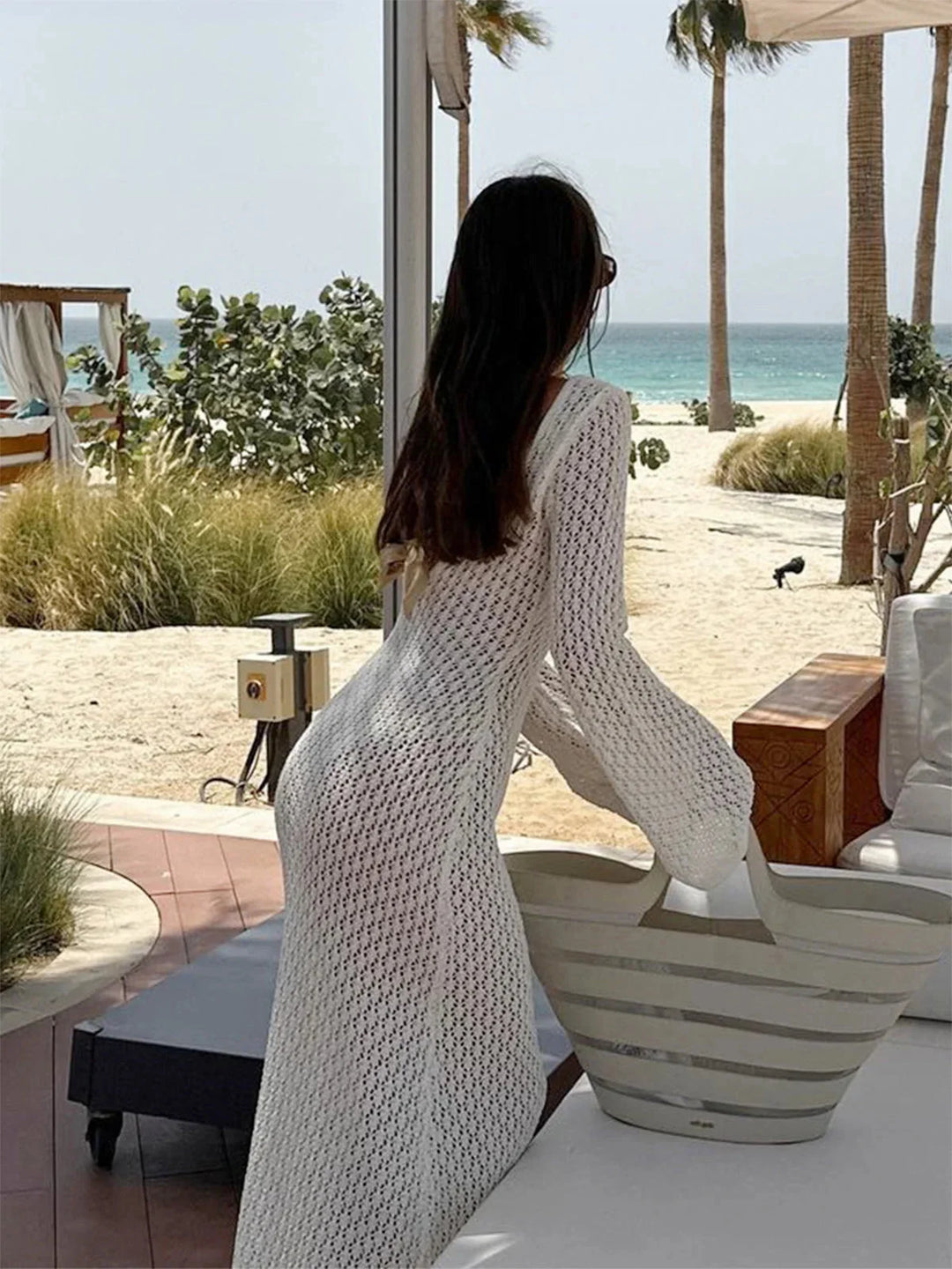 Long knit dress with cleavage tie in a soft heathered fabric, featuring a flattering silhouette for women by Nelle.