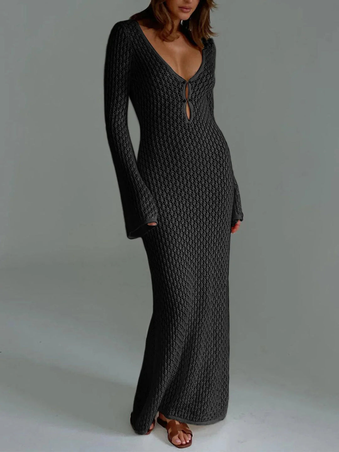 Black long knit dress with cleavage tie for women. Soft and comfortable material, featuring a stylish design perfect for any…