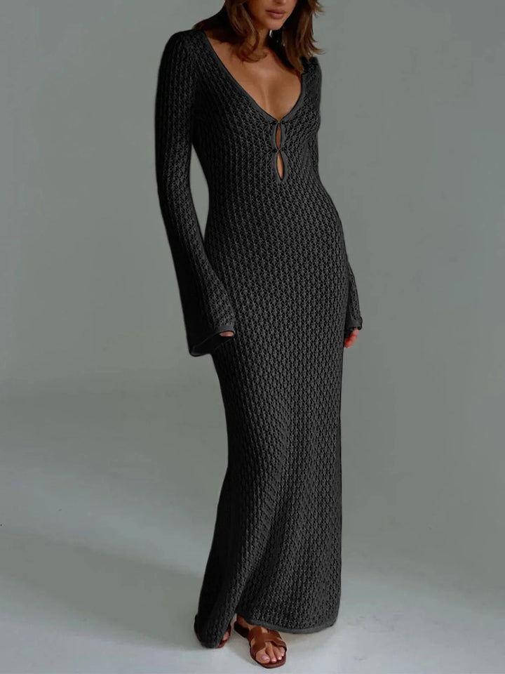 Black long knit dress with cleavage tie for women. Soft and comfortable material, featuring a stylish design perfect for any…