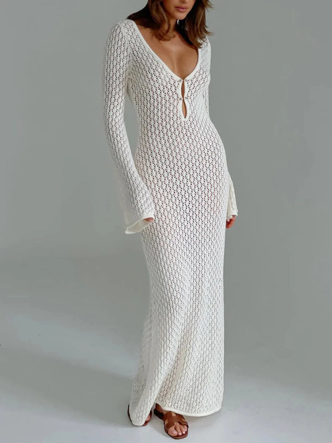 White knit dress for women with cleavage tie detailing. Knee-length, long sleeves, ribbed fabric with a comfortable fit.