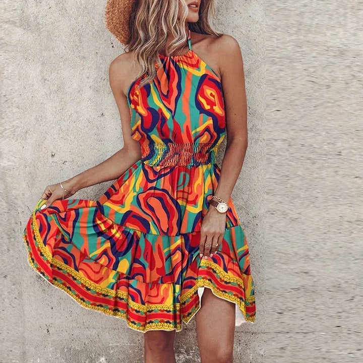 Orange halter neck mini dress with a vibrant design. Features a flattering silhouette and made of high-quality fabric.